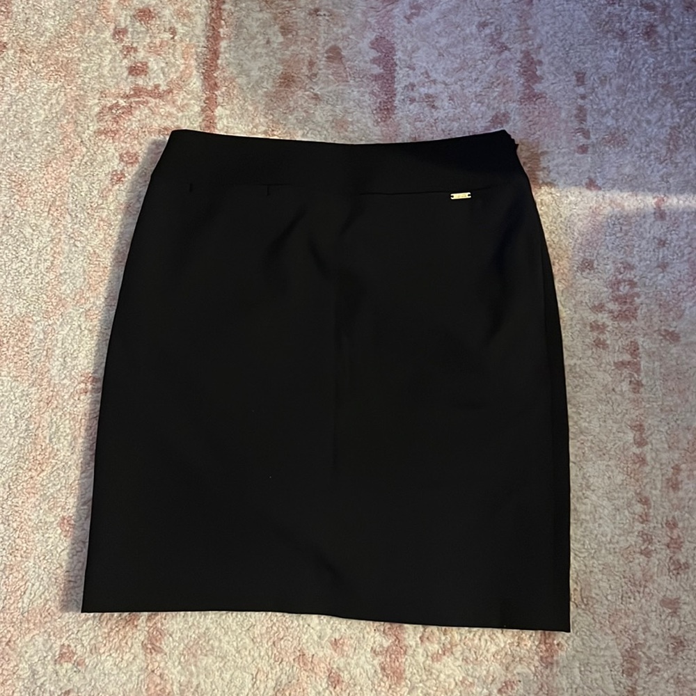 Tahari ASL black pencil skirt with gold detailing, double slit in back. Size 0P.